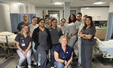 Group of Herzing Tampa nursing students participating in laboratory simulation experience